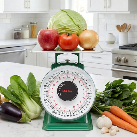 50 Lb Heavy Duty Mechanical Dial Kitchen Scale with Stainless Steel Platform showing fruits and vegetables on scale in kitchen setting
