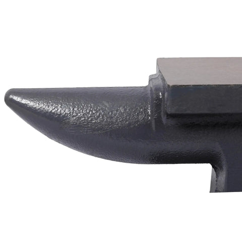 Close-up view of single horn on heavy duty cast iron anvil with stable base for blacksmiths, pro grade tool with high hardness 200HB.