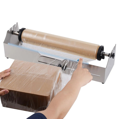 Heavy Duty Stainless Steel Tabletop Stretch Film Dispenser With Smooth Slide Cutter For 16 To 26 Inch Plastic Wrap Rolls in use wrapping a box.