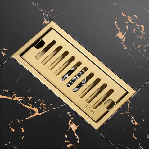 Heavy Duty Gold Linear Shower Drain With Brick Pattern Grate And Built In Hair Catcher For Bathrooms That Keeps Things Fresh With Quick Drain Performance And Smooth Operation Zero Drama Setup Brings Home The Best on black marble floor.