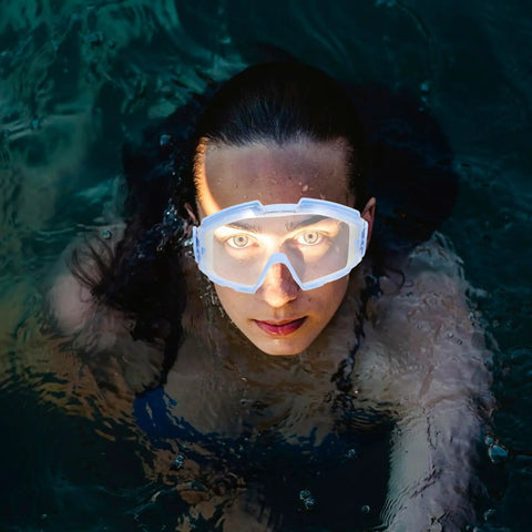 Heavy Duty Blue Safety Goggles With Anti Fog Ventilation And Side Shields To Keep Your Peepers Locked Up Tight Against Flying Debris Dust And Splashes On Any Rough Job Site worn by a person underwater.