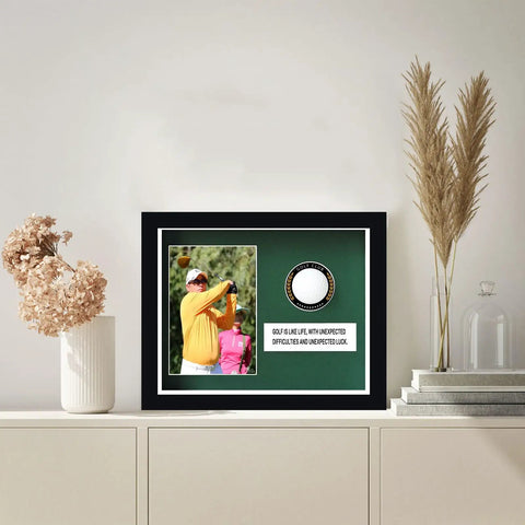 Premium Golf Ball Display Cabinet With Glass Door And 4x6 Photo Frame shown on shelf, solid wood frame, UV protected.