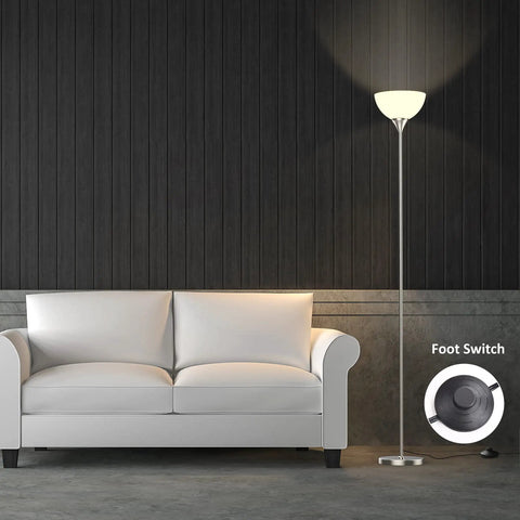 Torchiere Floor Lamp With Remote Control And 4 Color Temperatures in brushed nickel next to a sofa, foot pedal visible
