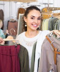 Woman organizing clothes with 300 Pack Plastic White Clothes Hanger End Caps With Rounded Corners No Glue Needed Protective Covers.