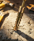 Close-up of a metal anchor from Beefy Hollow Wall Anchors With Screws Kit For Stripped Holes And Loose Hinges in solid block