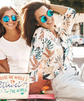 Two women smiling outdoors with Funny Travel Makeup Bag For Women, Multiuse Cosmetic Case And Toiletry Organizer visible in corner.