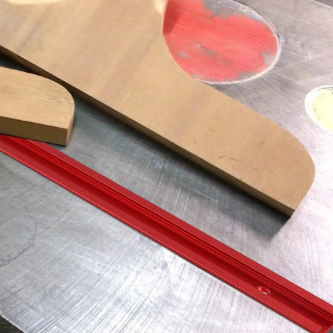 Aluminum T Track Miter Jig For Woodworking Router Table With Red T Slot Track And Quick Acting Clamp, wooden surface, metal table
