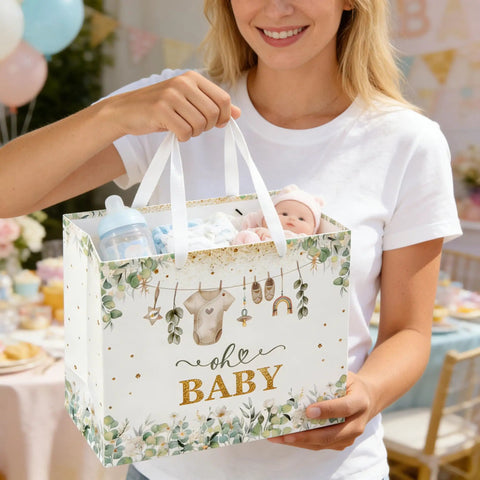 Woman holding 13 Inch Large Baby Gift Bag With Tissue Paper Greeting Card And Handle All In One Baby Shower Gift Set For Boys And Girls Green Birthday Parties For Any Occasion