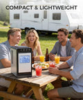 Compact Countertop Ice Maker With No Fuss Self Cleaning on picnic table with people, trailer in background