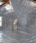 Premium Radiant Barrier Insulation Foil Roll Covers 1000 Square Feet Four Feet Wide installed in an attic space.