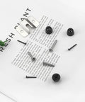 Portable Dartboard Mounting Bracket Kit with screws, nails, and stabilizers on a white background