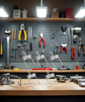 Value Pack Ten Stainless Steel Torsion Springs 50mm With 90 Degree Deflection arranged on a workbench in a workshop setting