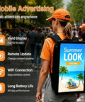 Sick Wearable Digital Signage Backpack Sporting A 21.5 Inch FHD IPS Panel With Sunlight Readable Brightness And WiFi Connectivity For Seamless MP4 Video Playback And Street Ad Drops That Instantly Pop Off on a busy street.