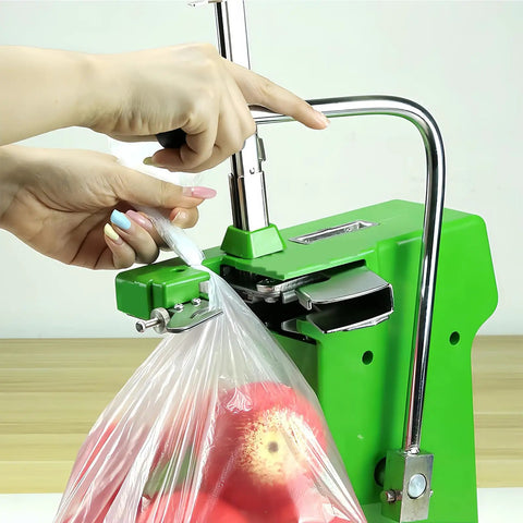 Heavy Duty Desktop Plastic Bag Sealing Machine Ties Bags Fast With Adjustable Pressure And Built-in Cutter Includes 2000 U-Shaped Clips Perfect For Fruit Shops And Small Biz sealing a plastic bag with apples.
