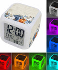 Real Deal Cube Digital Alarm Clock Straight Up Showcasing A Fresh Seven Color Led Night Light With Chill Thanksgiving Pumpkin Vibes Plus Handy Snooze Feature And Time Date Temp Readout For Desk in beige plastic with digital display.