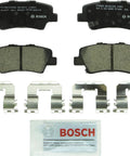Bosch BC1544 QuietCast ceramic rear brake pad set with four mounting clips and lubricant packet