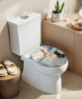 Elongated deck chair sandy beach waters edge seas Toilet Seat on a modern white toilet with sunset view design.