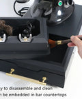 Hassle Free Automatic Portafilter Cleaning Machine With Knock Box showing cleaning brushes and large removable drawer for 58mm espresso groups.