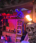 Skull Tiki Torch Set For Halloween Yard Decor, Handcrafted Skull Pattern Outdoor Lights illuminating a patio area, installed view.
