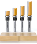 Fan Favorite Four Piece Flush Trim Router Bits Set One Quarter Inch Shank Top Bearing Carbide Steel Delivers Pro Grade Cuts And Sleek Edges For Fast Woodworking Projects on display with wooden base.