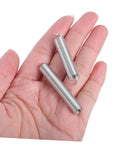 Get That Pro Tool Vibe With These 200 Pcs Assorted Springs Including Compression And Extension Options For DIY Repairs, Home Fixes, Auto Jobs, And Mechanical Tasks A Must Have Portable Hardware Kit Built To Last. two steel compression springs in hand