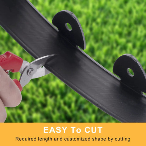 Cutting black lawn border from 40 Foot Landscape Edging Kit With 2 Inch Tall Black Lawn Border Pro Grade Build Includes Scissors 36 Garden Spikes And 2 Connectors Heavy Duty PP And PE For Neatly Defined Gardens Lawns And Landscaping