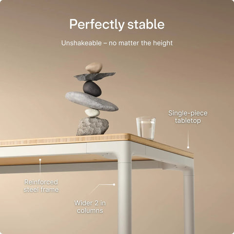 Rock Solid Electric Standing Desk Gliding Smoothly On Ultra Quiet Quad Motors Sixty Three Inch Worktop showcasing stable design with rock balancing.