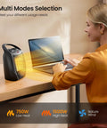 Compact Ceramic Space Heater With Adjustable Thermostat And Overheat Protection in use on desk, black model, 750W/1500W