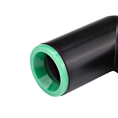 Raindrip 1/2-in compression elbow, close-up of black plastic pipe end with green compression ring