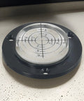 Micpointik 50x12mm Circular Bubble Level with clear viewing glass and black base for precise leveling measurements.