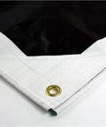 Corner detail of HydraTarp Super Beefy Heavy Duty 16 Mil Tarp, 18 By 24 Feet, reversible white and brown with brass grommet.