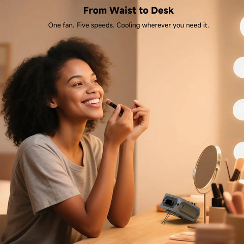Woman using Go-To Portable Waist And Neck Cooling Fan With 10000mAh battery in a vanity setting