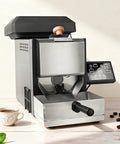 Compact Home Coffee Bean Roaster 300g Electric Direct Fire Machine With Built In Bean Cooler For Straight Up Fresh Roasts and Barista Level Consistency Perfect For Kitchen And Office Brews on a countertop with coffee beans.
