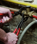 Using Cobra Locking Pliers Set Two Piece With Fine Adjustment For Different Sized Workpieces on plumbing pipe.
