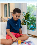 Child playing with Arcade Electronics Exploration Kit For Kids Ages 8 And Up Dozens Of Hands On Projects Full Color Project Manual Safe STEM