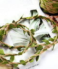 Natural Green Leaf Jute Twine Rope 2mm 3-Ply, 33 Feet Heavy Duty Hemp String for hanging, decorated with green leaves.
