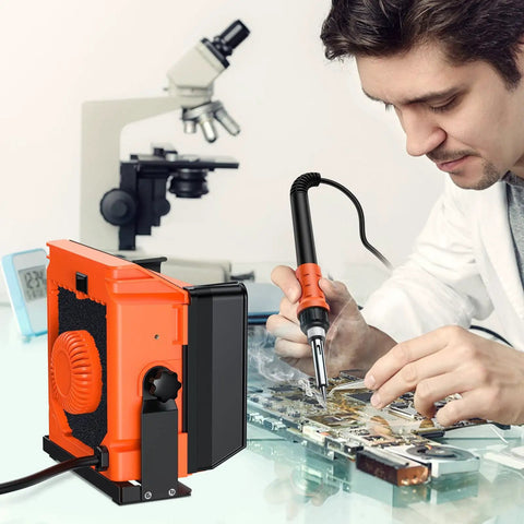 Man using Solder Smoke Absorber Kit With Tiltable Fume Extractor and Flexible Helping Hands for precise circuitry work.