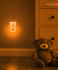 Amber Night Light Plug In Dusk To Dawn Sensor Night Light With Amber Glow And Blue Light Blocking in a bedroom at night