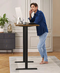 Person using a modern workspace with Beefy Dual Motor Standing Desk Frame With Electric Adjustable Legs For 44 To 90 Inch Desktops