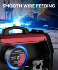 Flux Core Welding Wire.030 E71T-GS Gasless Low Splatter MIG Wire unit showing wire feeding with bright weld sparks in background.