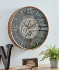 Killer Twenty Four Inch Oversized Wall Clock Featuring Real Moving Gears Heavily Distressed Antique Gold Dial Bold Roman Numerals on wall.