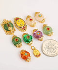 Top Shelf Sand Gold Inlay Stone DIY Jewelry Beads Featuring Braided Rope Accents And Durable Baking Lacquer Coating For Fly Bracelets Necklaces And Badass Pendant Spacers Pack Of 10, assorted colorful beads with gold accents and a coin for scale.