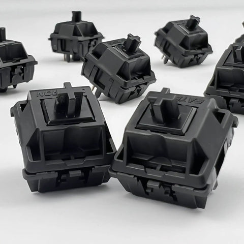 Oil King V2 Pre-Lubed Black Linear Keyboard Switches Pack Of 10, close-up view of switches on white background