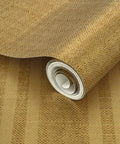 Top Tier Weathered Stripe Gold Metallic Wallpaper For Dope Indoor Walls Featuring Hella Stylish Fibrous Texture and Paste The Wall Application showing rolled wallpaper.