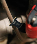 Badass Reciprocating Saw Blades One Three Eighth Inch Carbide Tipped Titanium Coated Metal Cutter cutting through metal pipe.