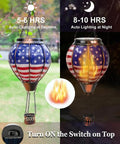 Solar Hot Air Balloon Lantern With Flickering Flame, Glass Outdoor Hanging Lantern For Patio Porch Yard, showing American flag design during day and night