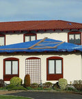 Heavy Duty Waterproof Poly Tarp 5 Mil All Purpose Cover For Outdoor Protection Tough As Nails For Construction Camping And Yard Projects Cut To 20 By 40 Feet Finished At 19 Feet 4 Inches By 39 Feet 4 Inches Blue covering house roof.