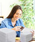 Woman packing small item in 100 Pcs Bubble Mailers Set Four Sizes Self Adhesive Waterproof Padded Envelopes For Safe Shipping