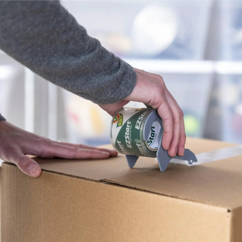 Using EZ Start Packing Tape With One Handed Dispenser 1.88 Inch By 55.5 Yard Crystal Clear Tape Roll to seal a box smoothly