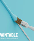 Paint brush applying blue paint on Half Round Cord Hider Cable Cover for TV Wires and Wall Mount Cables, Decorative White Wire Covers